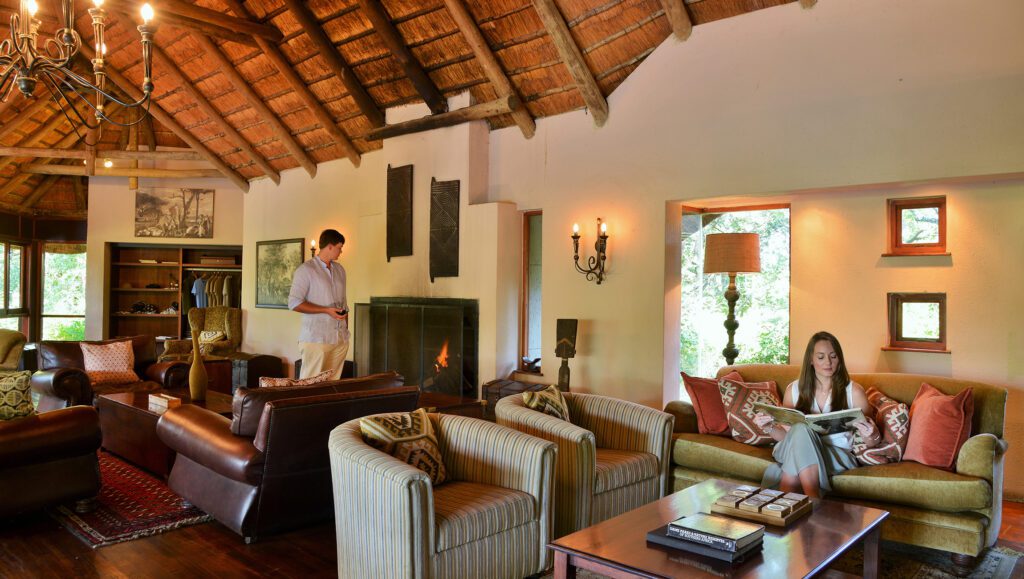 Extraordinary Imbali Safari Lodge Couple relaxing in the main lounge Extraordinary Imbali Safari Lodge Couple relaxing in the main lounge