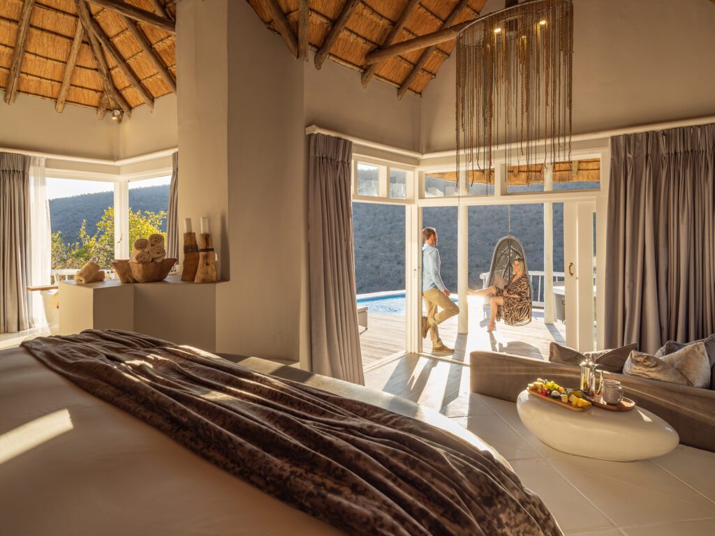 Clifftop Exclusive Safari Hideaway private suite view with guests Clifftop Exclusive Safari Hideaway private suite view with guests